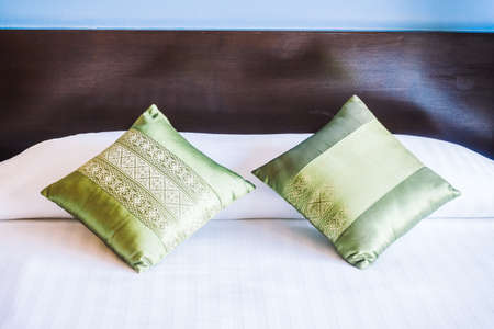 Beautiful luxury pillow on bed decoration in bedroom interior - Vintage light Filter