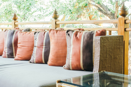 Pillow on sofa and chair decoration in living room interior - Vintage Light Filterの写真素材