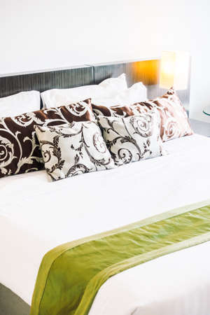 Beautiful luxury pillow on bed decoration in bedroom interior - Vintage light Filterの写真素材