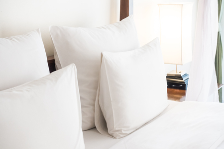 Swan towel decoration on bed with white pillow in bedroom interiorの写真素材