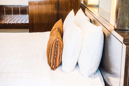 Beautiful luxury pillow on bed decoration in bedroom area interior - Vintage light Filterの写真素材