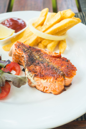 Selective focus on Salmon steak on white plateの写真素材