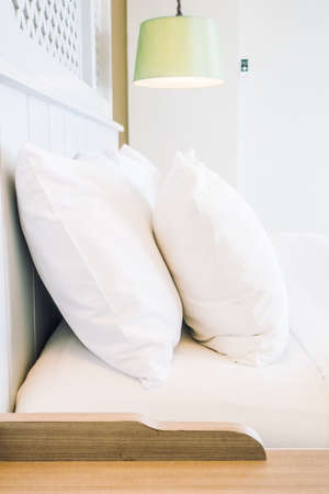 Beautiful luxury comfort pillow on bed decoration in bedroom interior - Vintage light Filterの写真素材