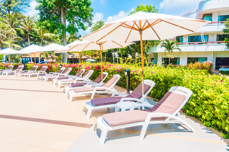 Beautiful luxury umbrella and chair around outdoor swimming pool in hotel resort - Holiday Vacation concept for backgroundのeditorial素材