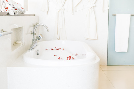 Beautiful luxury white bathtub decoration in bathroom interior - Vintage light Filterの写真素材
