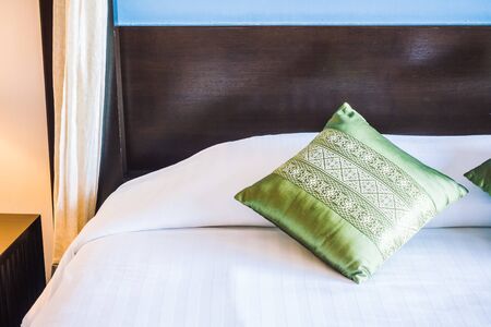 Beautiful luxury pillow on bed decoration in bedroom interior - Vintage light Filterの写真素材