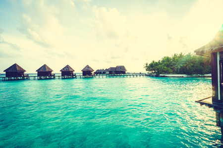 Beautiful tropical Maldives island with beach and sea for nature holiday vacation background concept - Vintage Filter and Boost up color Processingの写真素材