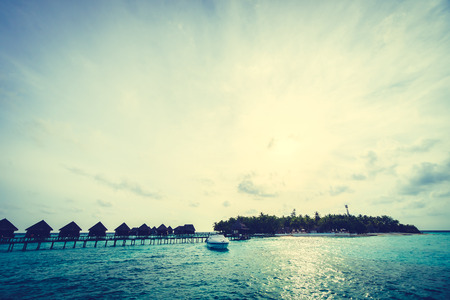 Beautiful tropical Maldives island with beach and sea for nature holiday vacation background concept - Vintage Filter and Boost up color Processingのeditorial素材