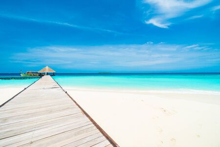 Beautiful tropical Maldives resort hotel and island with beach and sea on sky for holiday vacation background concept - Boost up color Processingのeditorial素材