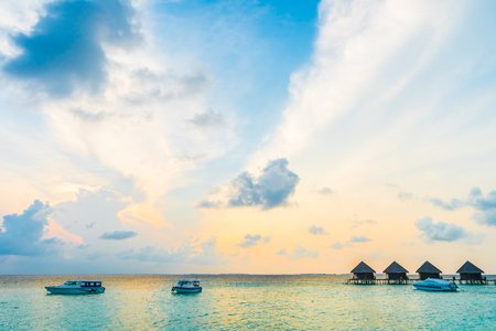 Beautiful tropical Maldives resort hotel and island with beach and sea on sky for holiday vacation background concept -Boost up color Processingのeditorial素材