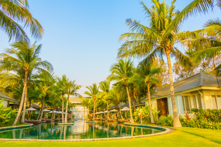 Beautiful luxury Umbrella and chair around swimming pool in hotel pool resort - Vintage Light Filterのeditorial素材