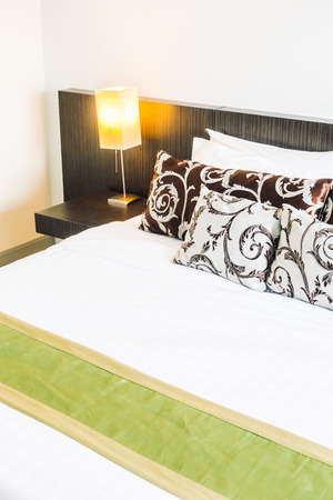 Beautiful luxury pillow on bed decoration in bedroom interior - Vintage light Filterの写真素材