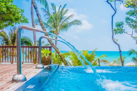 Beautiful luxury umbrella and chair around swimming pool in hotel resortのeditorial素材