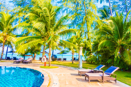 Umbrella and chair around beautiful luxury outdoor swimming pool in hotel resort - Boost up color Processingのeditorial素材