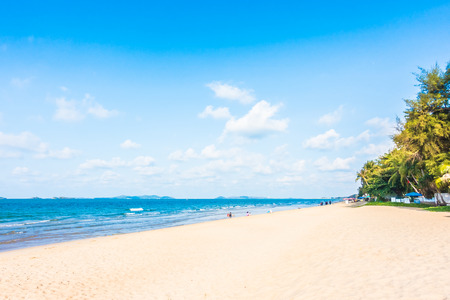 Umbrella and chair on beautiful tropical beach and sea - Boost up color Processing - Holiday vacation concept backgroundの写真素材