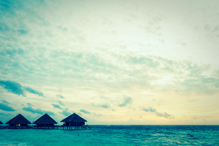 Beautiful tropical beach and sea at sunset times in maldvies island - Vintage Filterの写真素材