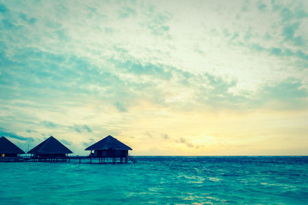 Beautiful tropical beach and sea at sunset times in maldvies island - Vintage Filterの写真素材