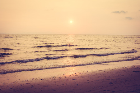 Beautiful sunset with sky and cloud on the beach and seascape - Vintage Filter and Boost up color Processingの写真素材
