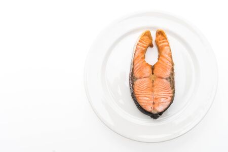 Fried steak salmon meat in white plate isolated on white background - Healthy food styleの写真素材