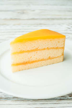Selective focus point on orange dessert cakeの写真素材