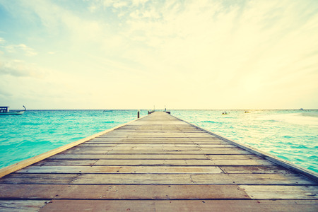 Beautiful tropical Maldives island with beach and sea for nature holiday vacation background concept - Vintage Filter and Boost up color Processingの写真素材