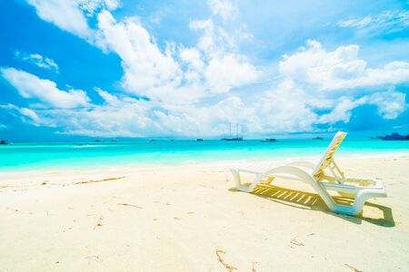 Beautiful tropical beach and sea in maldives island with coconut palm tree and blue sky backgroundの写真素材
