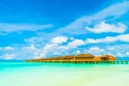 Beautiful tropical beach and sea in maldives island with coconut palm tree and blue sky backgroundのeditorial素材