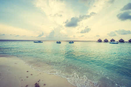 Beautiful tropical Maldives resort hotel and island with beach and sea on sky for holiday vacation background concept -Boost up color Processingのeditorial素材