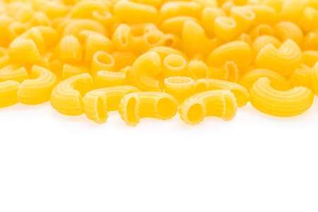 Yellow dry pasta and spaghetti for italian food ingredient isolated on white backgroundの写真素材