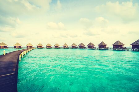 Beautiful tropical Maldives island with beach and sea for nature holiday vacation background concept - Vintage Filter and Boost up color Processingのeditorial素材