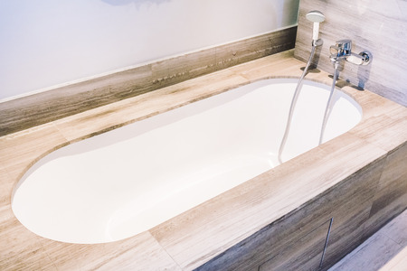 Beautiful luxury bathtub decoration in bathroom and toilet interior - Vintage light Filterの写真素材