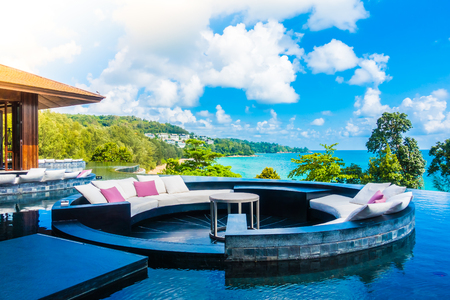 Beautiful luxury outdoor patio with pillow on sofa decoration in hotel resort with sea and ocean viewのeditorial素材