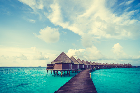 Beautiful tropical Maldives resort hotel and island with beach and sea on sky for holiday vacation background concept -Boost up color Processingのeditorial素材