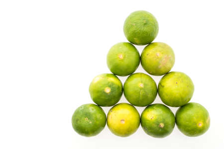 Green lemon isolated on white backgroundの写真素材