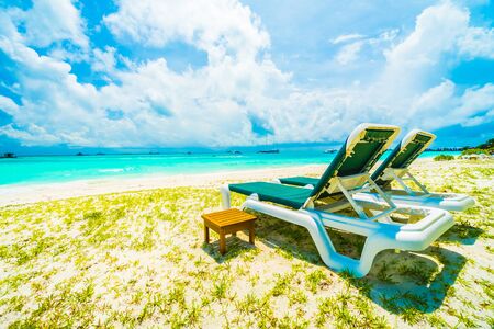 Beautiful tropical beach and sea in maldives island with coconut palm tree and blue sky backgroundの写真素材