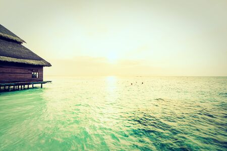 Beautiful tropical Maldives resort hotel and island with beach and sea on sky for holiday vacation background concept - Boost up color Processing and Vintage Filterのeditorial素材