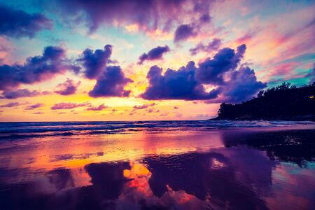 Beautiful sunset on the beach and sea with cloud and sky background - Vintage Filterの写真素材