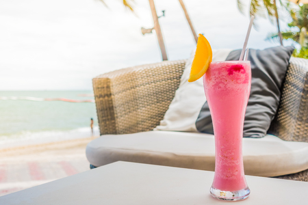 Mocktail glass with beach and sea backgroundの写真素材