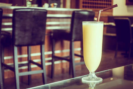 Mango smoothies glass in restaurant - Vintage Filter