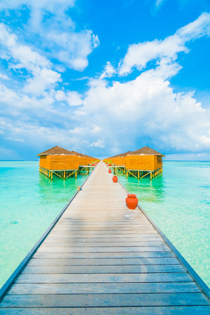 Beautiful tropical beach and sea with water bungalow on blue sky in Maldives island - Boost up color Processingのeditorial素材