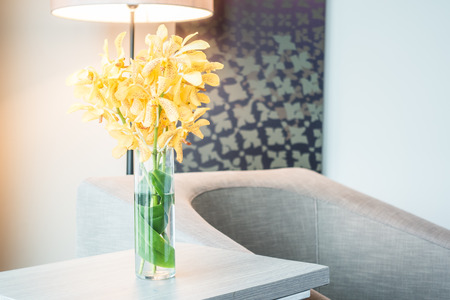 Vase flower on wooden table decoration interior of roomの写真素材