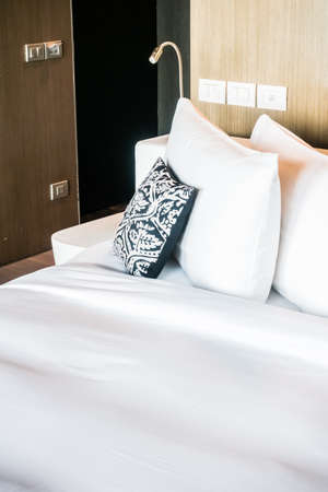 Beautiful pillow on bed decoration in bedroom interior