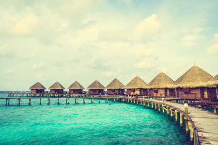 Beautiful tropical Maldives island with beach and sea for nature holiday vacation background concept - Vintage Filter and Boost up color Processingの写真素材