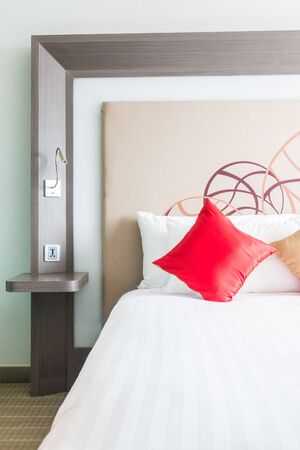 Beautiful pillow on bed decoration in bedroom interiorの写真素材