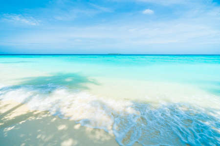 Beautiful tropical Maldives resort hotel and island with beach and sea on sky for holiday vacation background concept - Boost up color Processingの写真素材