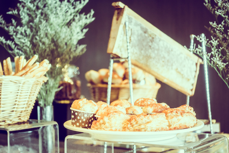 Selective focus point on Dessert catering buffet in hotel restaurant - Vintage Filterの写真素材