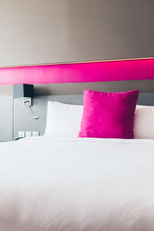 Beautiful pillow on bed decoration in bedroom interior
