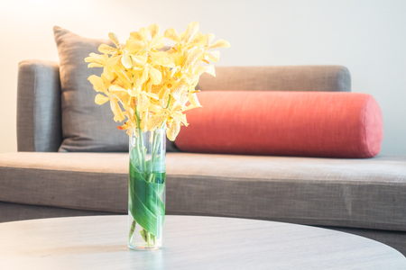Sofa with light lamp and vase flower decoration interior of roomの写真素材