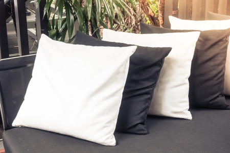 Beautiful pillow on sofa decoration with outdoor deck - Sunflare Effectの写真素材
