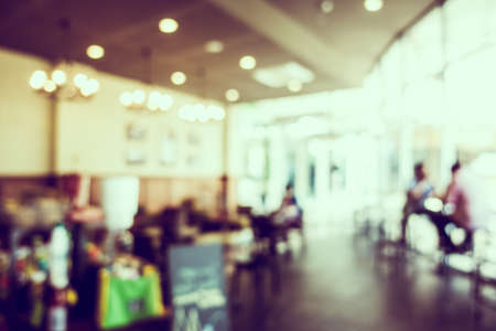 Abstract blur luxury coffee shop cafe interior for backgroundの写真素材